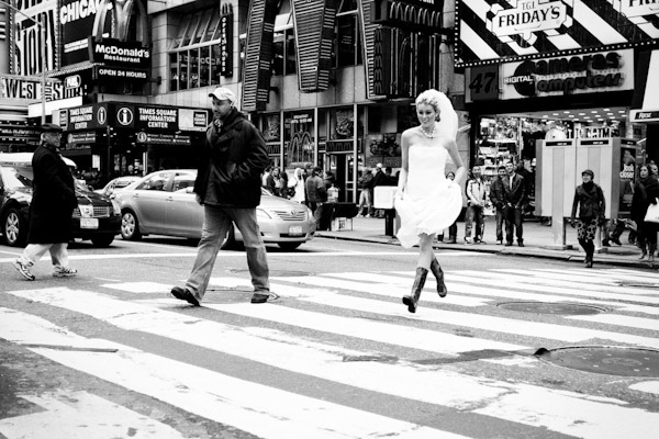 Adorable bride running across the street in Times Square - wedding photo by Adagion Studio